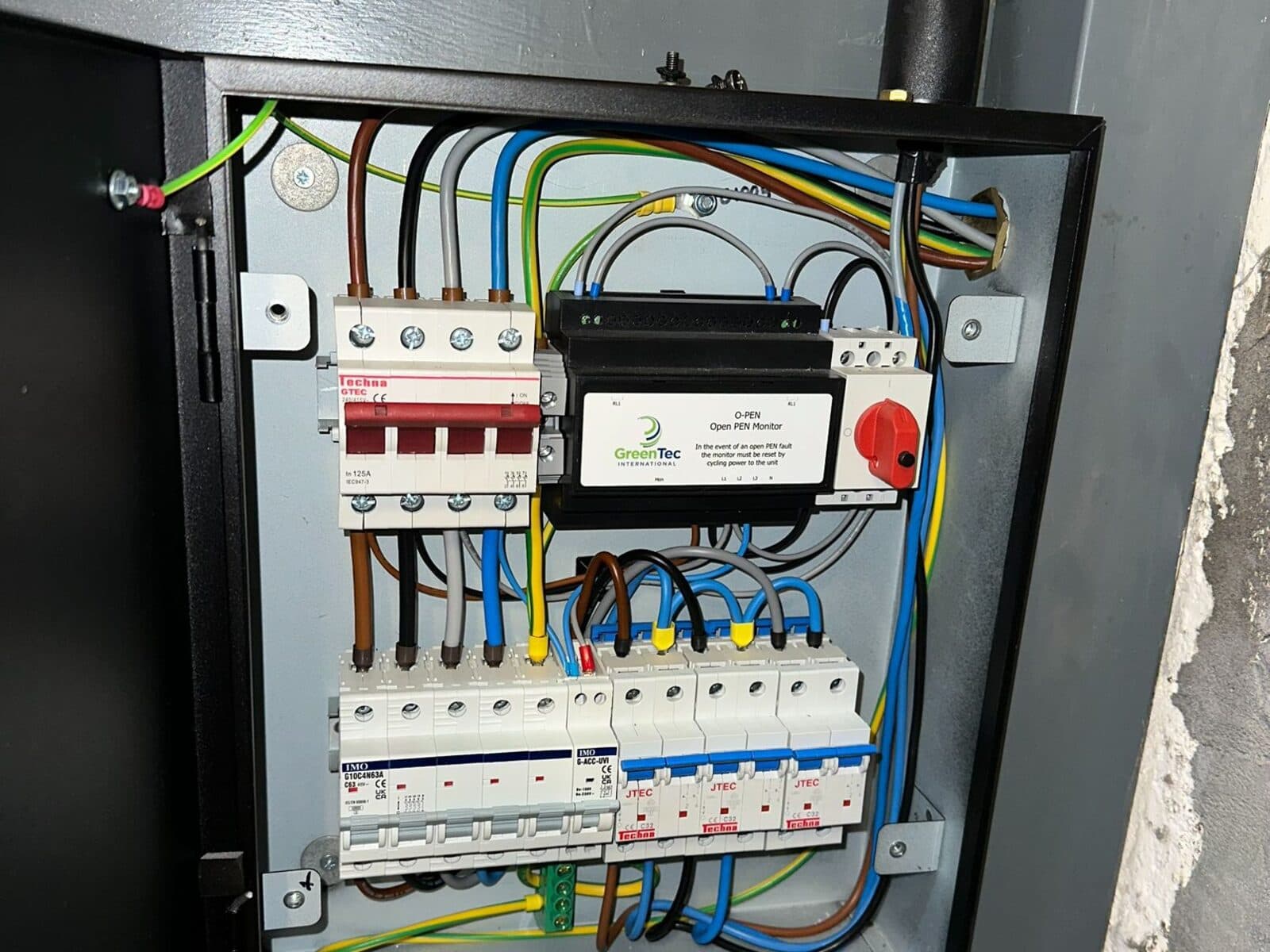 Three-phase distribution board in a commercial unit with the door open